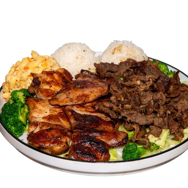 A large plate of grilled chicken, beef, macaroni salad, rice, and broccoli.