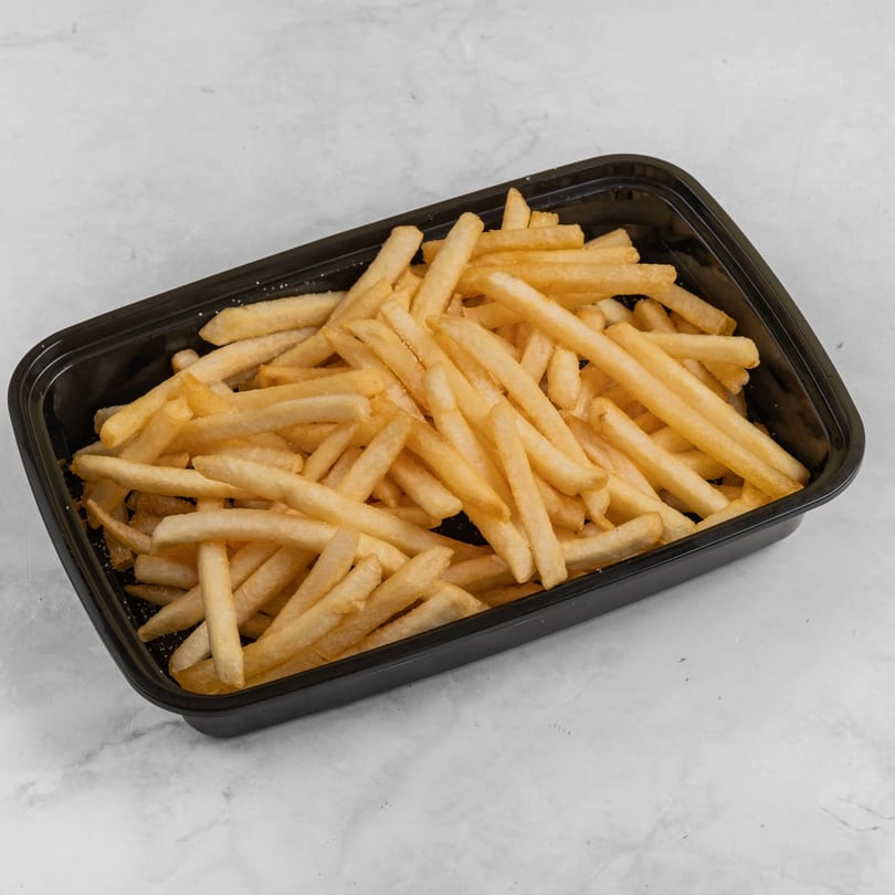 Golden french fries, lightly salted, served in a black rectangular takeout container from Everest Grill & Wrap.